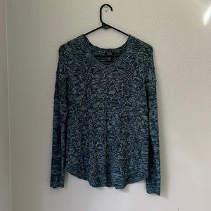 Blue and green knit sweater.